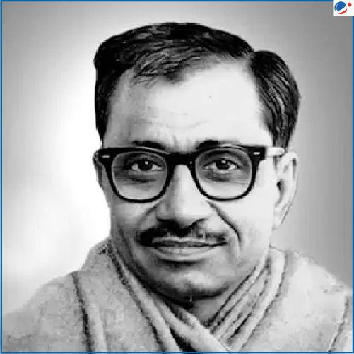 Black-and-white portrait of Pandit Deendayal Upadhyaya wearing glasses and a shawl, with a slight smile.