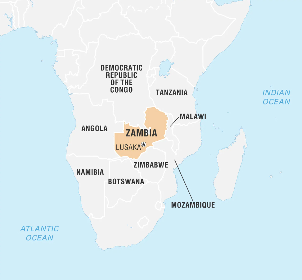 A map highlighting Zambia in southern Africa. Surrounding countries include Tanzania, Malawi, Mozambique, Zimbabwe, Botswana, Namibia, Angola, and the Democratic Republic of the Congo. The capital, Lusaka, is marked with a star. The Indian Ocean and Atlantic Ocean are also labeled.